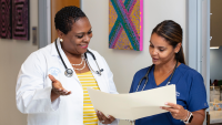 Clinician with nursing student.